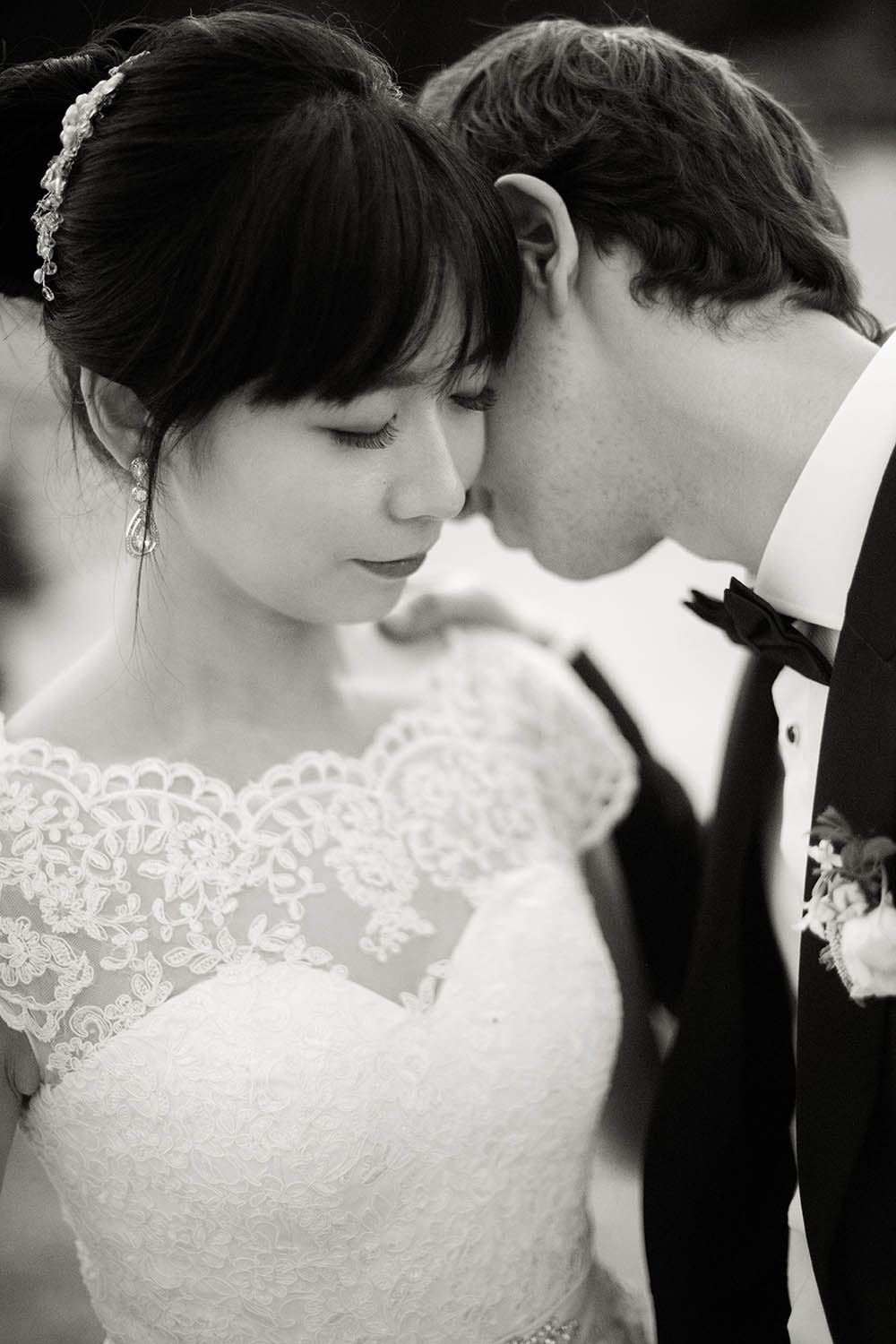 bride and groom kiss her